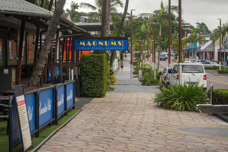 Looking down the main street of an empty beachside town.