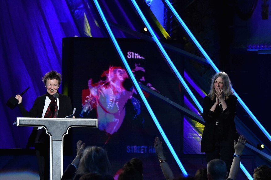 Laurie Anderson (L) accepts the Rock and Roll Hall of Fame induction on behalf of Lou Reed