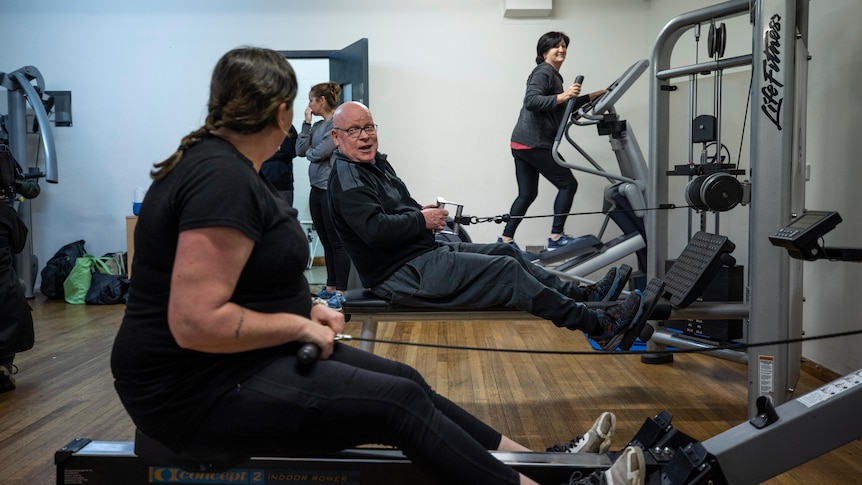 A man and a woman exercising.