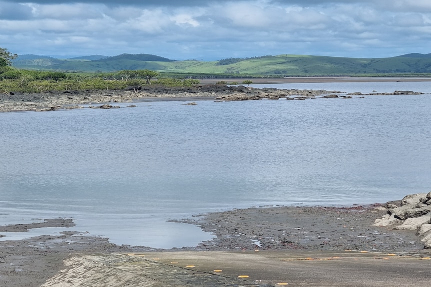 An estuary with hills in the background