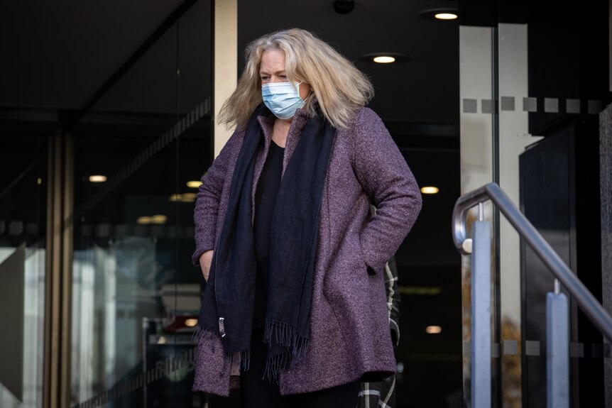 Former Glamorgan Spring Bay mayor Debbie Wisby leaving the Hobart Magistrates Court while wearing a face mask.