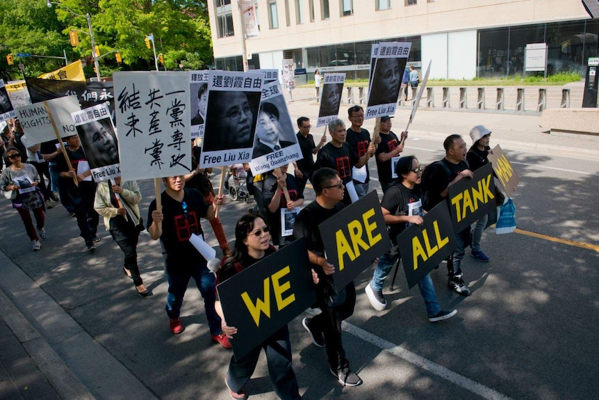 Overseas Chinese people were protesting in Toronto to Chinese Communist Party for releasing Liu Xia and Wang Quanzhang.