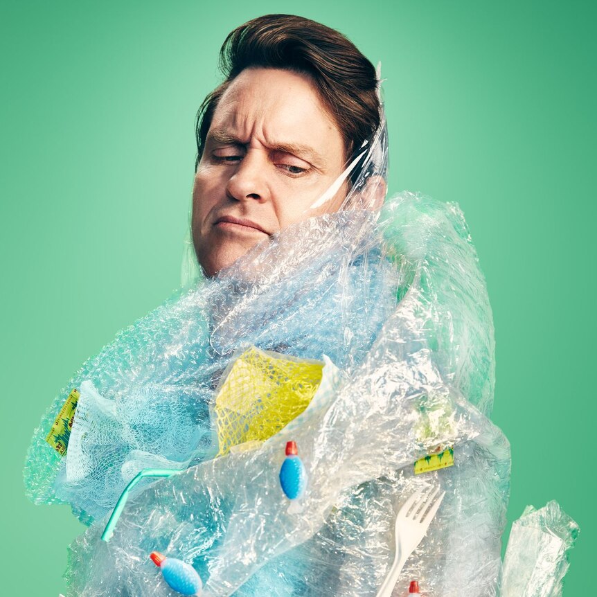 A man wrapped up in different plastics