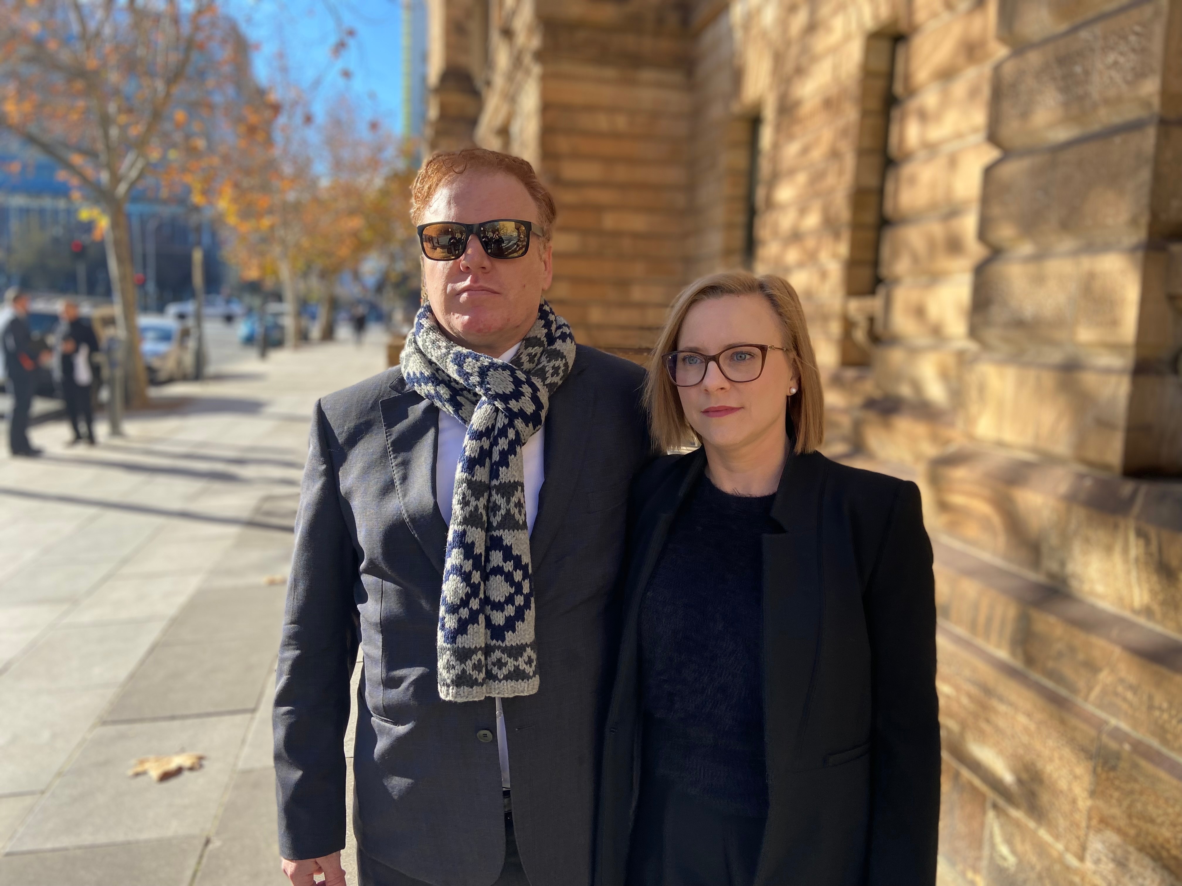 Two people outside an Adelaide court.