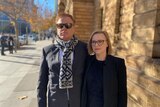 Two people outside an Adelaide court.