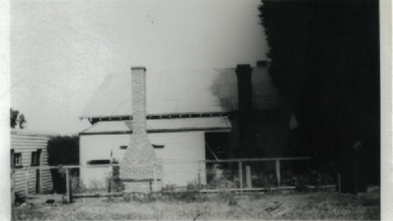 An old black and white photo of a house. 