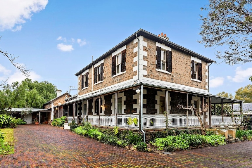 The exterior of an historic bluestone mansion in Magill.