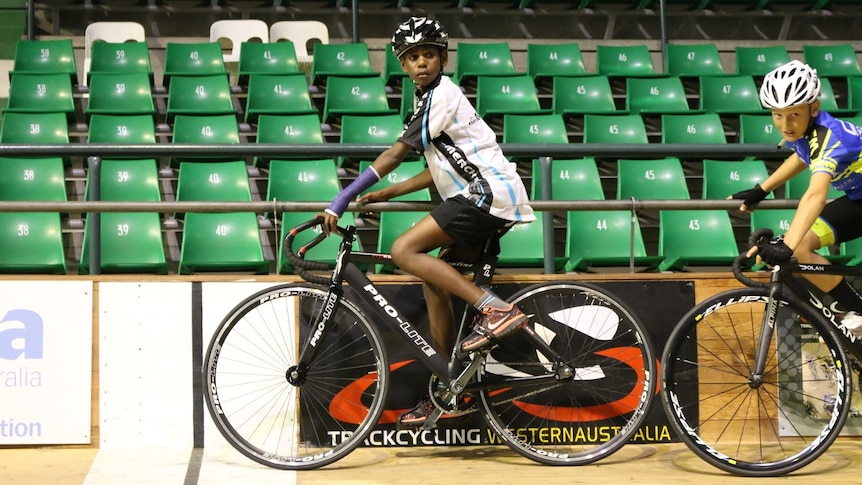 Rory Charles rides his bike around a circular bowl.