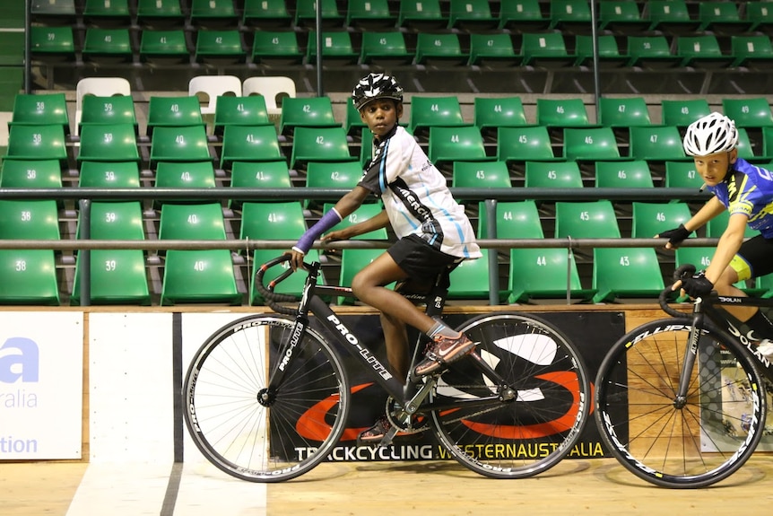 Rory Charles rides his bike around a circular bowl.