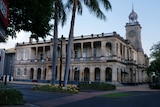 Rockhampton Post Office building, road and trees in front. 