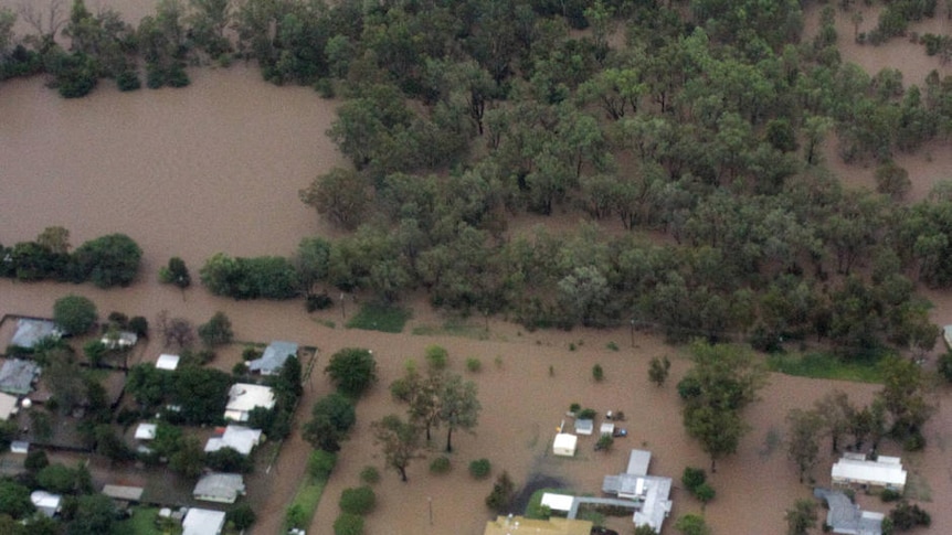 Flood water surges in Theodore on December 26, 2010.