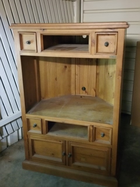 A pine television cabinet that had a sum of money found inside.