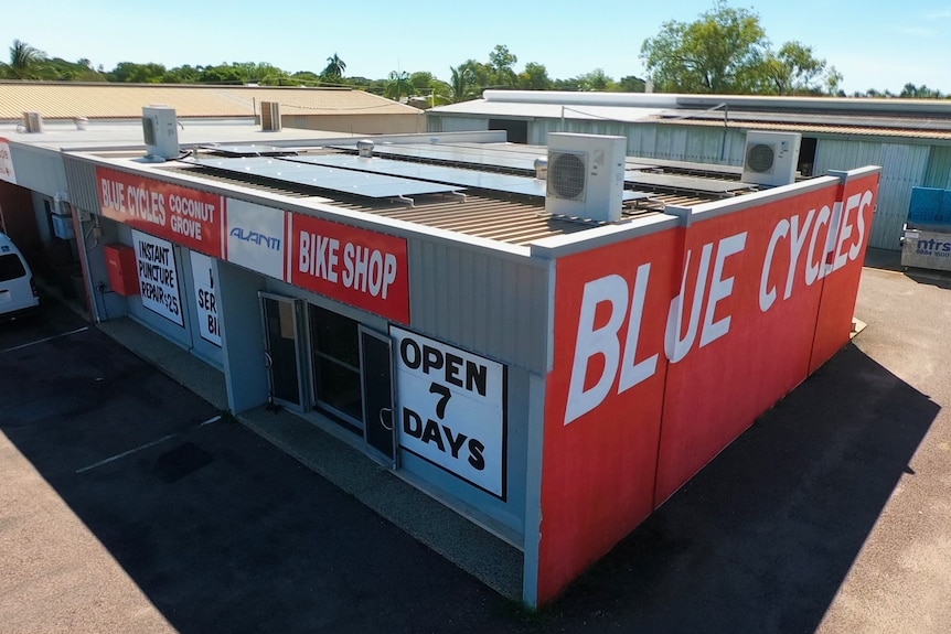 a drone photo of a store in a parking lot