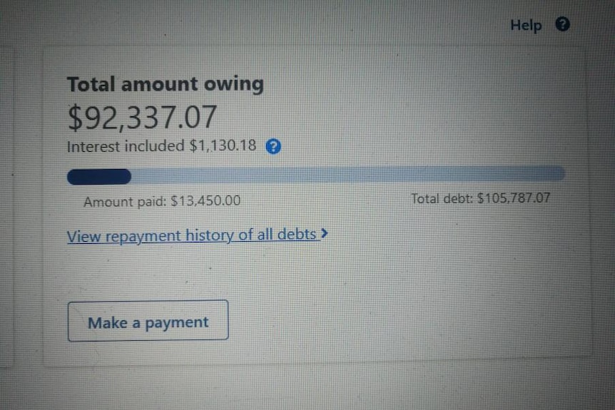 A photo of a screen which reads "Total amount owing $92,337.01"
