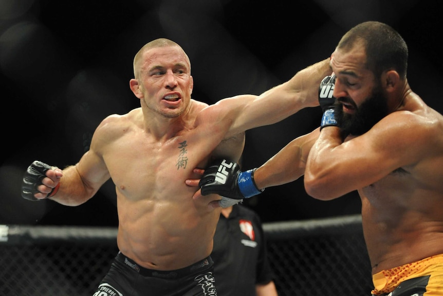 Georges St-Pierre fights Johny Hendricks in their UFC welterweight title bout