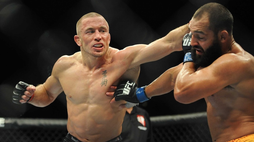 Georges St-Pierre fights Johny Hendricks in their UFC welterweight title bout