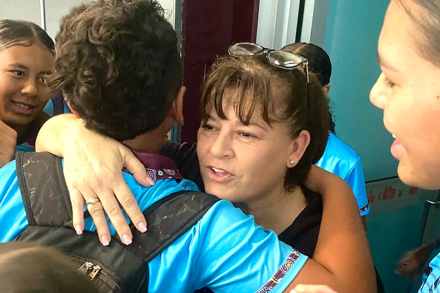 Belinda Beasley hugs a Gold Coast school student