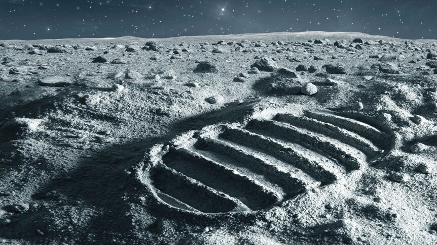 A large footprint of a space boot on the moon in the foreground with the moon's horizon in the background
