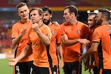 Brett Holman and Brisbane Roar celebrate their victory over the Wanderers.