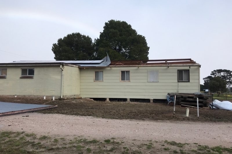 A club room with half the roof missing 