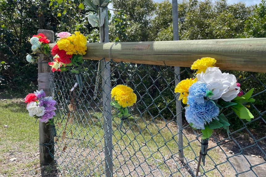 Flowers attached to a fence