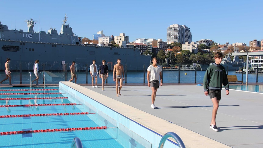 Male models walk the runway at Boy Charlton Pool.