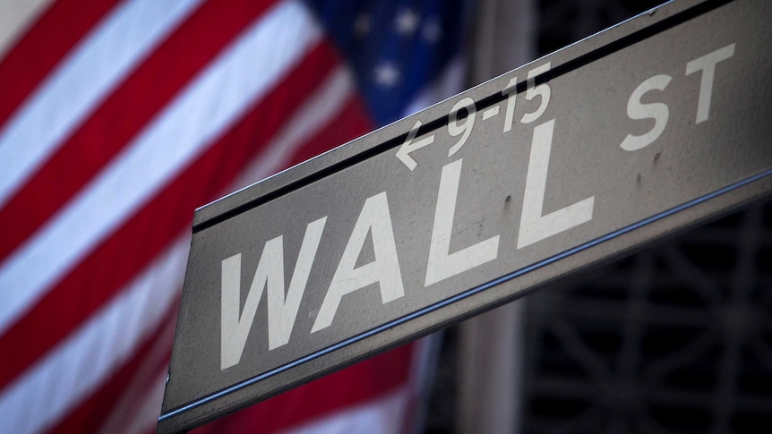 A Wall Street sign is pictured outside the New York Stock Exchange