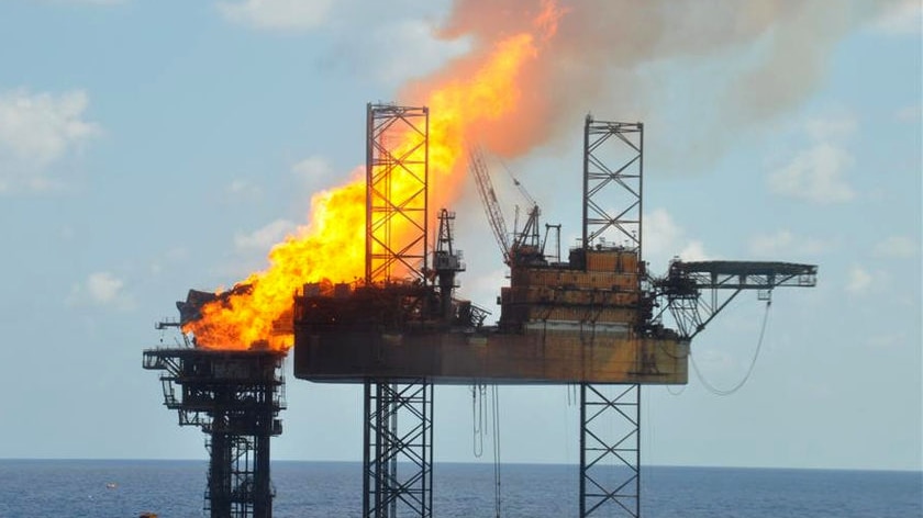 An oil platform engulfed in flames.