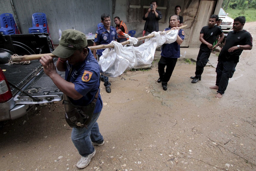 Body taken away from Thailand mass grave site of trafficked workers