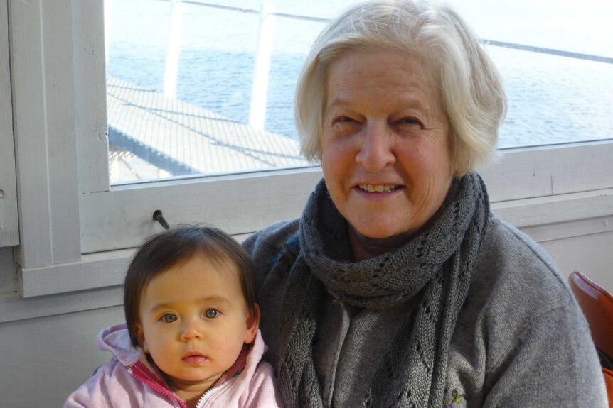 The author's mother, Pat, sits with her young granddaughter, but is worried about being lonely during coronavirus isolation