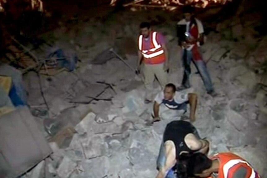Syrian rescue teams search for people after an explosion in Aleppo.