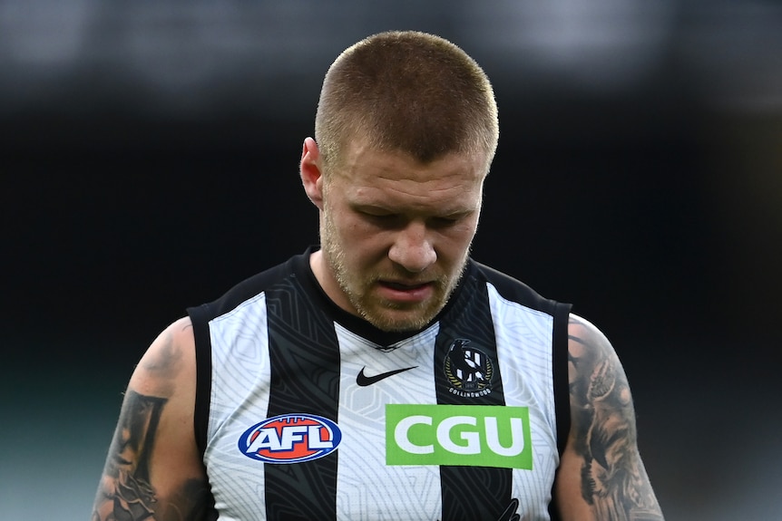 Jordan De Goey looks dejected as he leaves the field