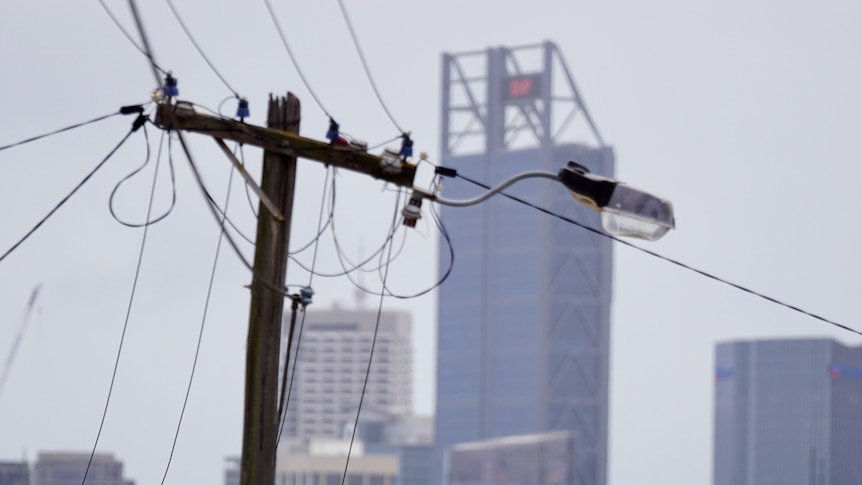 Photo of Power Poles with Perth City Buildings in the background