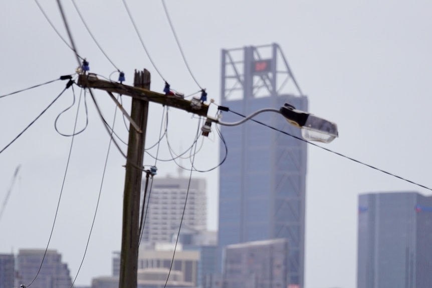 Photo of Power Poles with Perth City Buildings in the background