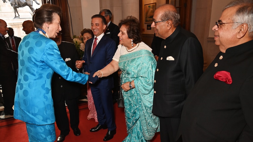 Princess Anne shaking hands with Kamal Hinduja 