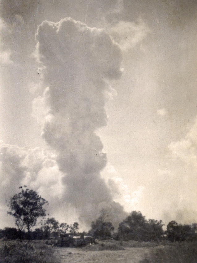 A smoke stack rises over Katherine after being bombed in 1942