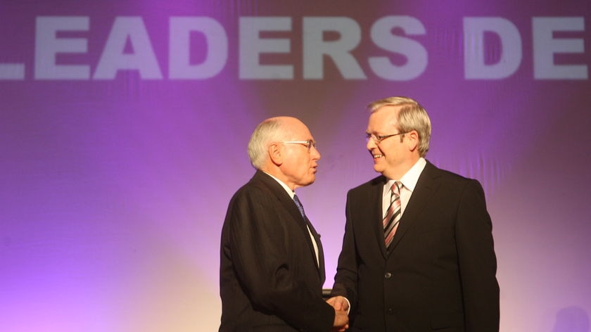 John Howard and Kevin Rudd shake hands before the start of the leaders' debate.