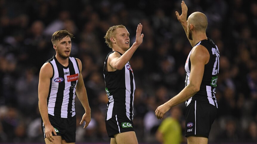 Jaidyn Stephenson of the Magpies (C) reacts after kicking a goal against Western Bulldogs.