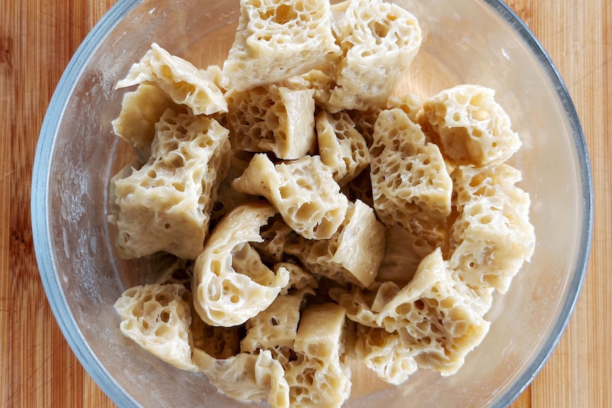 A bowl with pieces of seitan, a protein made from wheat starch.