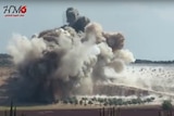 A huge cloud of smoke rises from an airstrike