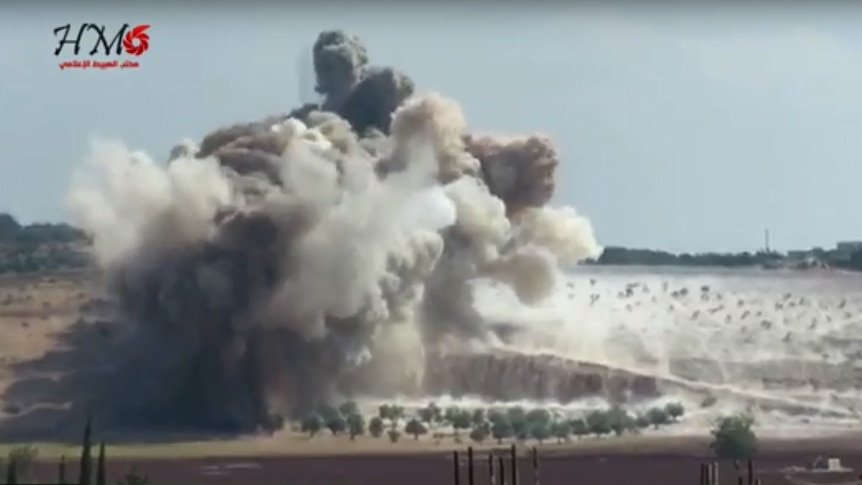 A huge cloud of smoke rises from an airstrike