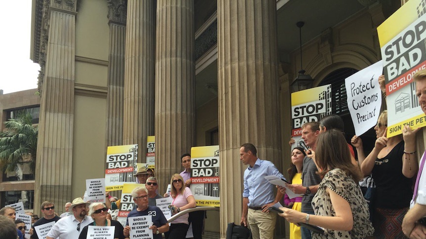 About 100 people turned up to protest at Brisbane's historic Customs House