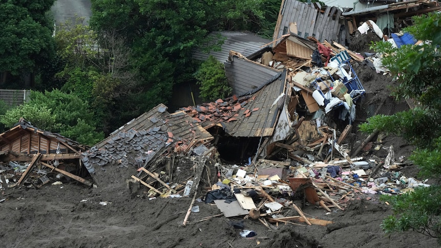 Image of crushed houses and debris surrounded in mud in Atami, Japan