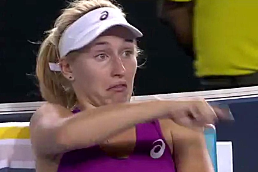 Tennis player Daria Gavrilova gestures while sitting courtside at the Australian Open.
