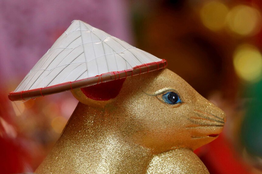 A rat statue is displayed for sale as decoration item ahead of the Lunar New Year celebrations.