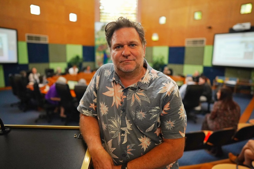 Byron Mayor Simon Richardson poses for the camera in a Hawaiian shirt.