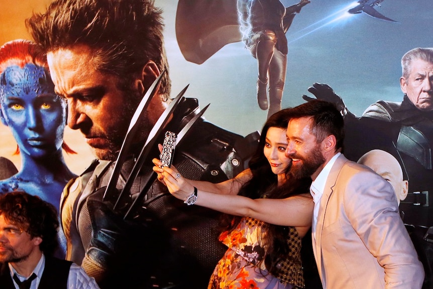 Fan Bingbing with Hugh Jackman at the launch of XMen: Days of Future Past in Singapore.