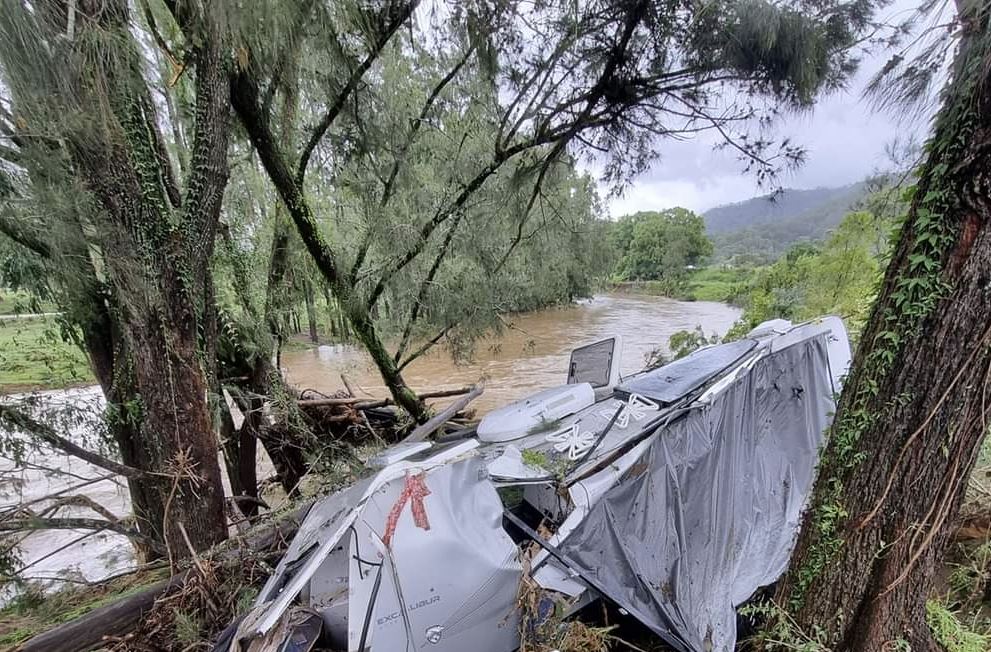 Caravan wreck on river bank