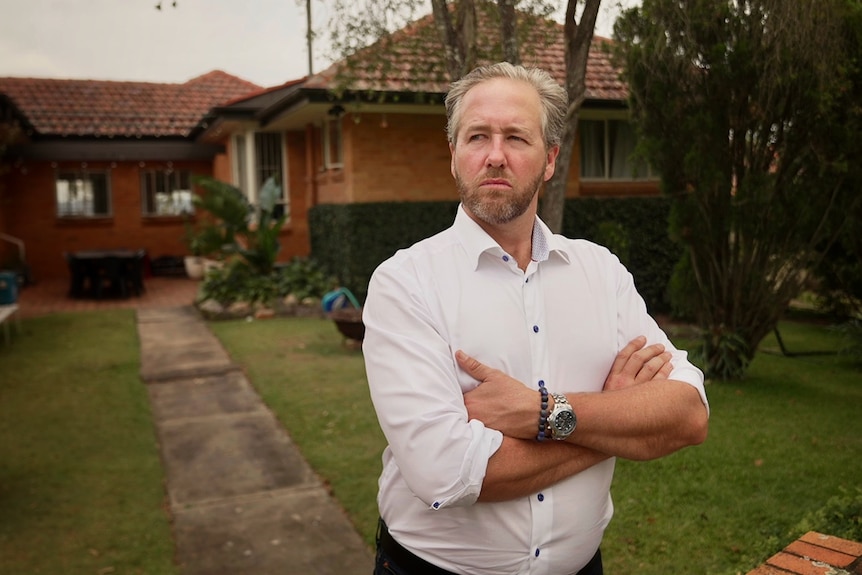 An image of Ben Cannon at home with arms crossed