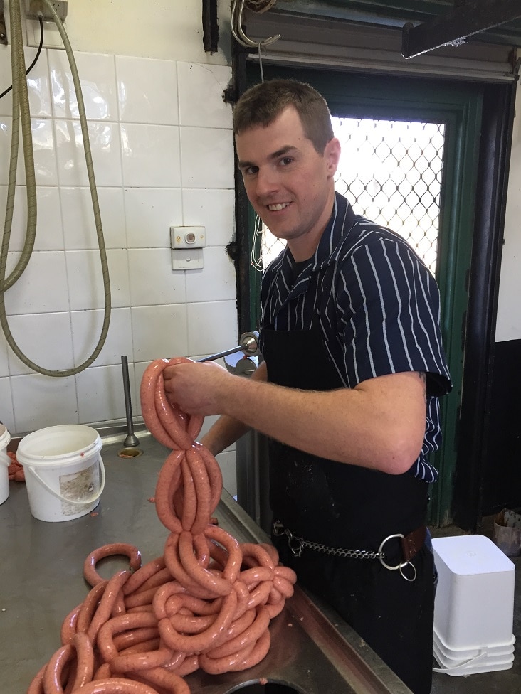 A man working in a butcher's shop